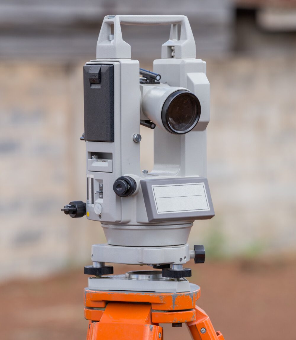 Surveyor equipment tacheometer or theodolite outdoors at construction site